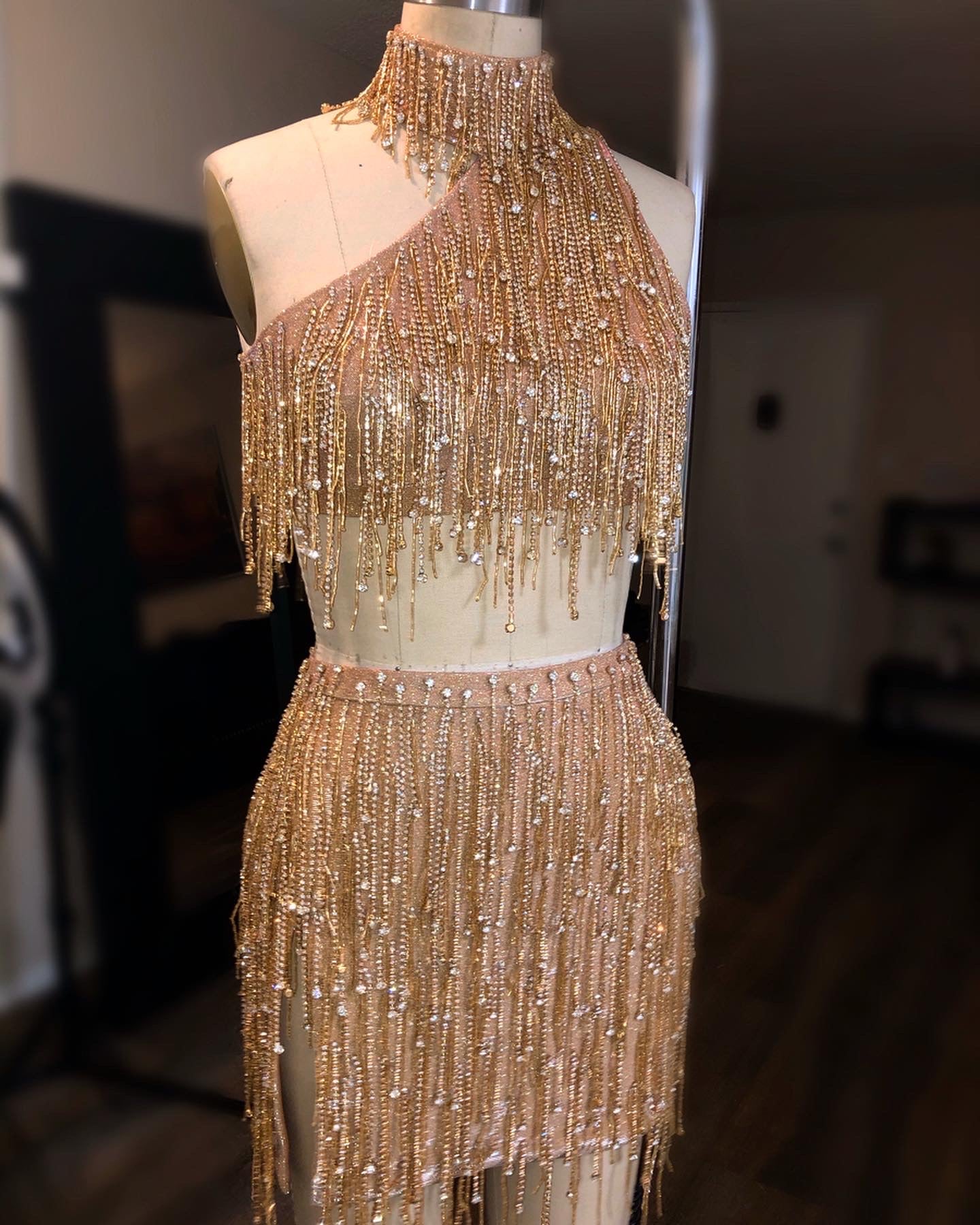 Cosmic Asymmetrical Fringe Peach And Gold Two Piece Look Cosmic Asymmetrical Fringe Peach And Gold Two Piece Look